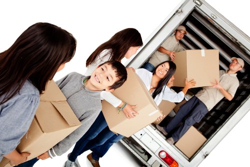 Movers using protective equipment during a safe house removal in Uxbridge