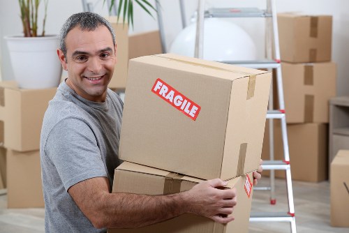 Packed moving boxes and furniture ready for transport in Uxbridge