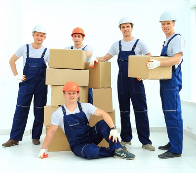 Packed moving boxes and furniture ready for loading