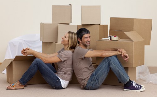 Careful loading of household items into a removals van