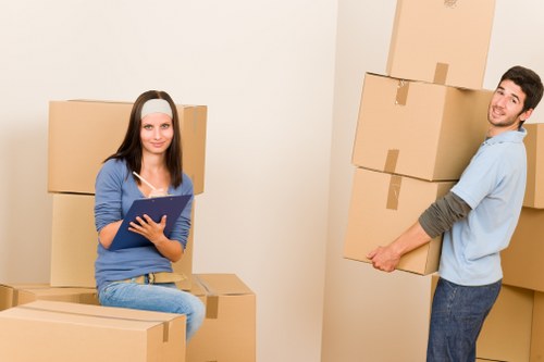 Local packing team preparing boxes in a Uxbridge property with limited access